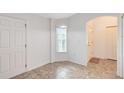 Bright and airy entryway with tile flooring and neutral colors at 2717 Shelby Ruth Pl, St Cloud, FL 34769