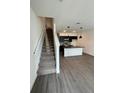 Open concept kitchen with island and modern dark cabinetry at 3237 Energy Drive, Kissimmee, FL 34747