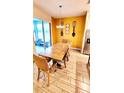 Dining room with a wooden table, neutral walls, and access to a patio at 421 Disa Dr, Davenport, FL 33837