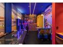 Fun game room with Mario theme, air hockey, and bar area at 4370 Rhyme St, Kissimmee, FL 34746