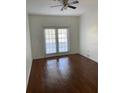 Bright bedroom with hardwood floors and French doors at 6413 Astor Village # 210, Orlando, FL 32835