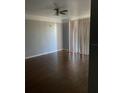 Living room with hardwood floors and sliding glass doors at 6413 Astor Village # 210, Orlando, FL 32835