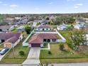 Single story home with solar panels and fenced yard at 667 Heraldo Ct, Kissimmee, FL 34758