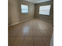Second bedroom with tile flooring and ample natural light at 710 Michigan Ct # 2, St Cloud, FL 34769
