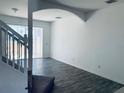 Bright living room with hardwood floors and access to a patio at 1240 S Beach Cir, Kissimmee, FL 34746