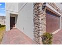Brick walkway leads to the front entrance of the home at 1254 Wispy Cypress Dr, Kissimmee, FL 34746