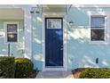 Blue front door with a white frame and a house number at 2015 Grand Oak Dr, Kissimmee, FL 34744