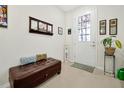 Entryway with bench, mirror, and decorative artwork at 2603 Amati Dr, Kissimmee, FL 34741
