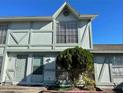 Light green two-story townhouse with a bit of landscaping at 3209 Windover Ave, Kissimmee, FL 34741