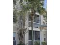 Condo building exterior showcasing balconies and landscaping at 3341 Whitestone Cir # 205, Kissimmee, FL 34741