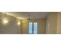 Bright living room featuring double doors and neutral walls at 3341 Whitestone Cir # 205, Kissimmee, FL 34741