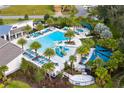 Resort-style community pool with a water slide and plenty of lounge chairs at 4439 Shiva Loop, Kissimmee, FL 34746