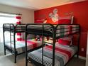 Mickey Mouse themed bedroom with a bunk bed, perfect for  at 4902 Windermere Ave, Kissimmee, FL 34746