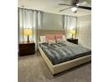 Spacious bedroom with a king-size bed and ample natural light at 4902 Windermere Ave, Kissimmee, FL 34746