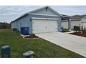 Two-car garage and nicely landscaped front yard at 1657 Rosydale Cir, Davenport, FL 33837