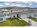 Two-story house, backyard, and neighborhood view at 332 Pink Ibis Bnd, St Cloud, FL 34772