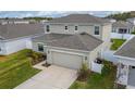Two-story house with a two-car garage and driveway at 332 Pink Ibis Bnd, St Cloud, FL 34772
