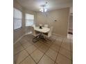 Bright dining room with white table and chairs at 520 Carlsbad Dr, Kissimmee, FL 34758
