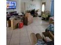 Spacious living room is staged with boxes and items for relocation at 615 Gazelle Dr, Kissimmee, FL 34759