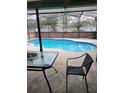 Relaxing screened-in pool area with a spacious deck, perfect for outdoor entertaining and enjoying the sun at 615 Gazelle Dr, Kissimmee, FL 34759