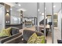Open living space with a view into kitchen and dining area at 7617 Wilmington Loop, Kissimmee, FL 34747