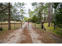 Gated entrance to a private property at 875 Eden Dr, St Cloud, FL 34771
