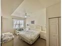 Bright bedroom with a double bed, white furniture, and large window at 4006 San Gallo Dr # 108, Kissimmee, FL 34741