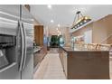 Modern kitchen with stainless steel appliances and island at 7537 Brooklyn Dr, Kissimmee, FL 34747