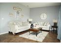 Living room with two sofas, a coffee table, and decorative pillows at 1028 Merrimack Blvd, Davenport, FL 33837