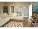 Spacious living room with sectional sofa and wood-look wall at 1028 Merrimack Blvd, Davenport, FL 33837