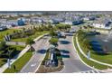 Aerial view of community entrance and neighborhood at 10425 Folly Beach Rd, Orlando, FL 32827