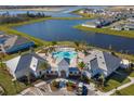 Aerial view of community pool, clubhouse and lake at 10425 Folly Beach Rd, Orlando, FL 32827