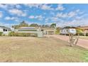 Single-story home with solar panels and a camper at 109 Arrowhead Ln, Haines City, FL 33844