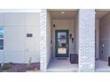 Modern townhome entry with green door and brick accents at 1138 Kingsbarn St, Davenport, FL 33896
