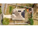House with solar panels, a shed, and a spacious backyard at 203 North Cir, Davenport, FL 33837