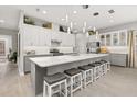 Spacious kitchen with large island, white cabinets, and gray countertops at 2051 Flora Pass Pl, Kissimmee, FL 34747