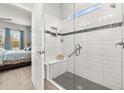 Large walk-in shower with glass enclosure and built-in seat at 2051 Flora Pass Pl, Kissimmee, FL 34747