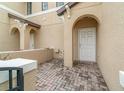 Front entry with brick pavers and a white door at 2226 Seven Oaks Dr, St Cloud, FL 34772