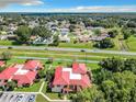 Aerial view showing a townhouse and surrounding neighborhood at 540 Hunter Cir, Kissimmee, FL 34758