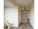 Covered entryway with tiled flooring and decorative accents at 580 Teesdale, Haines City, FL 33844