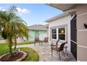 Cozy patio with wicker chairs and lush greenery at 580 Teesdale, Haines City, FL 33844