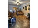 Spacious living room featuring hardwood floors and leather furniture at 704 N 8Th St, Haines City, FL 33844