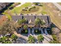 Aerial view of townhomes and the golf course in the community at 7588 Assembly Ln, Reunion, FL 34747