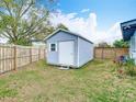 Charming backyard featuring a storage shed and a wood fence at 420 Sunrise Dr, Orlando, FL 32803
