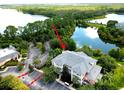 Aerial view showcasing a condo building near a lake at 801 New Providence # B19/U801, Davenport, FL 33897