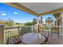 Relaxing outdoor patio with golf course views and comfortable seating at 1108 Sunset View Cir # 204, Reunion, FL 34747