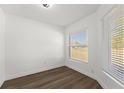 Empty bedroom with wood-look flooring and bright windows at 13404 Sw 60Th Court Rd, Ocala, FL 34473