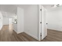 Bright hallway with light wood flooring leading to other rooms at 13404 Sw 60Th Court Rd, Ocala, FL 34473