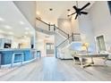 Bright living room with high ceilings and a staircase at 2949 Zaharias Dr, Orlando, FL 32837