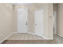 Clean entryway with tile flooring and two doors at 319 Sand Ridge Dr, Davenport, FL 33896